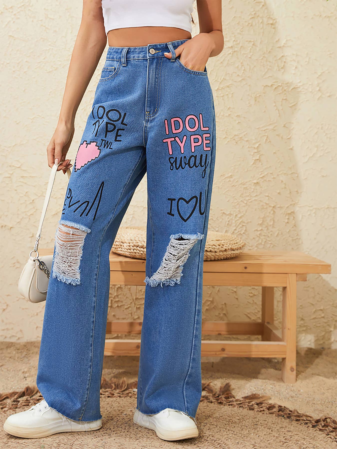 Graffiti printed loose,ripped denim trousers