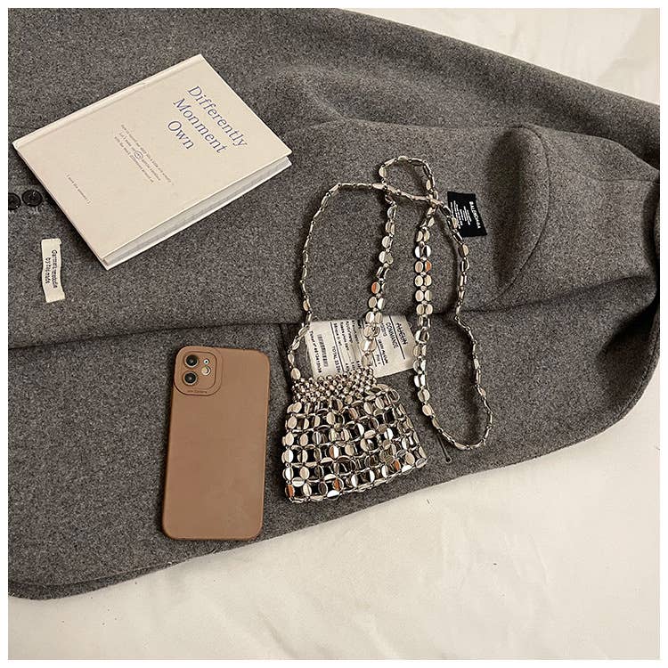 Fashionable hollowed-out glossy crossbody bag