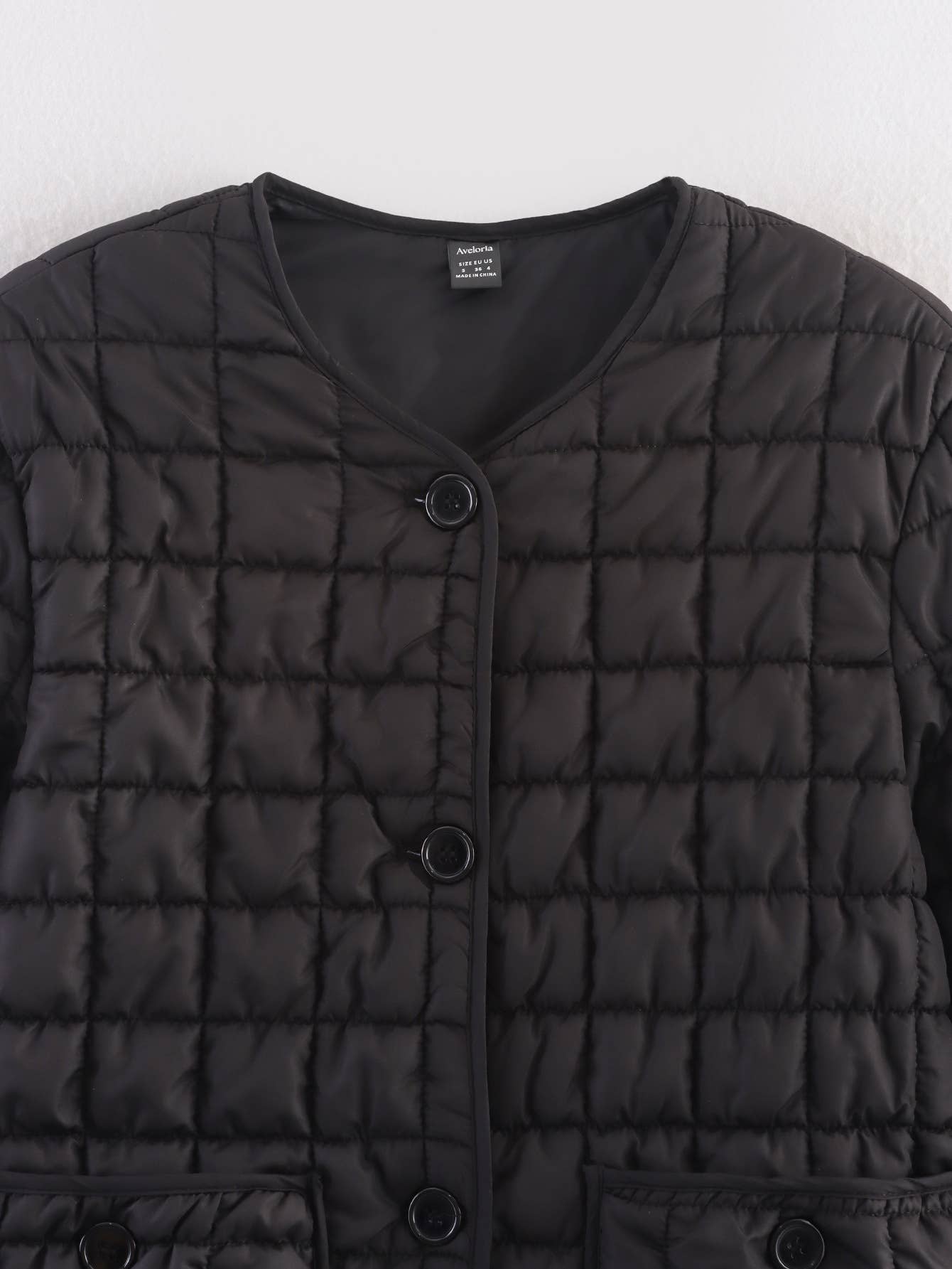 Short textured quilted three-dimensional coat