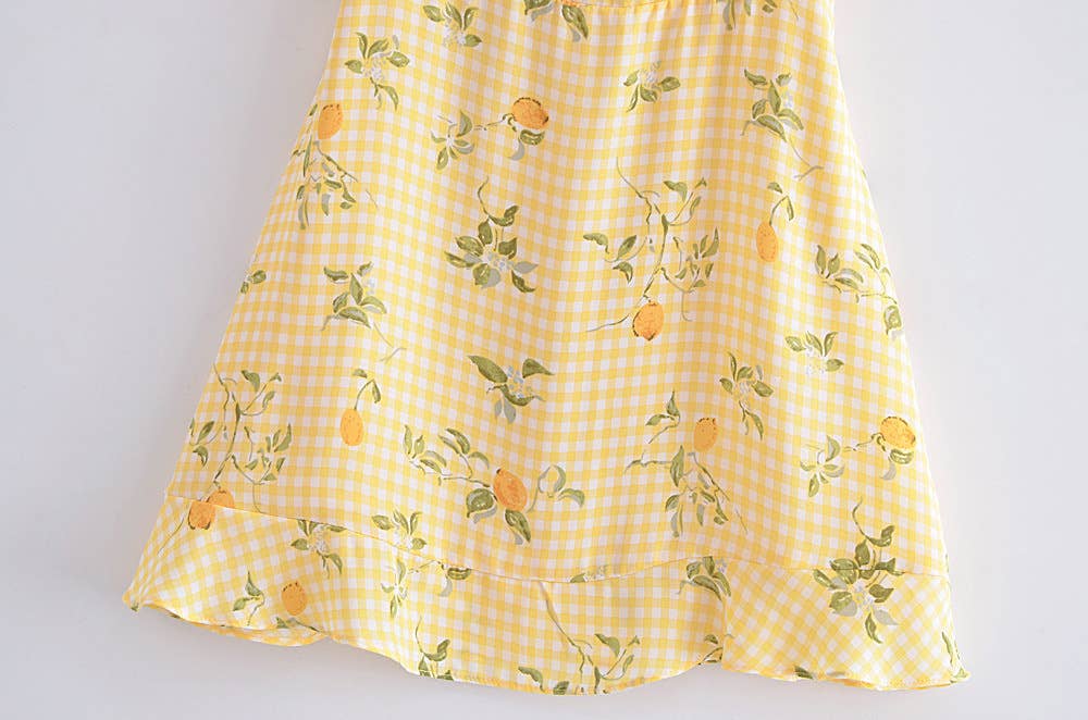 A strappy dress with floral prints and ruffles