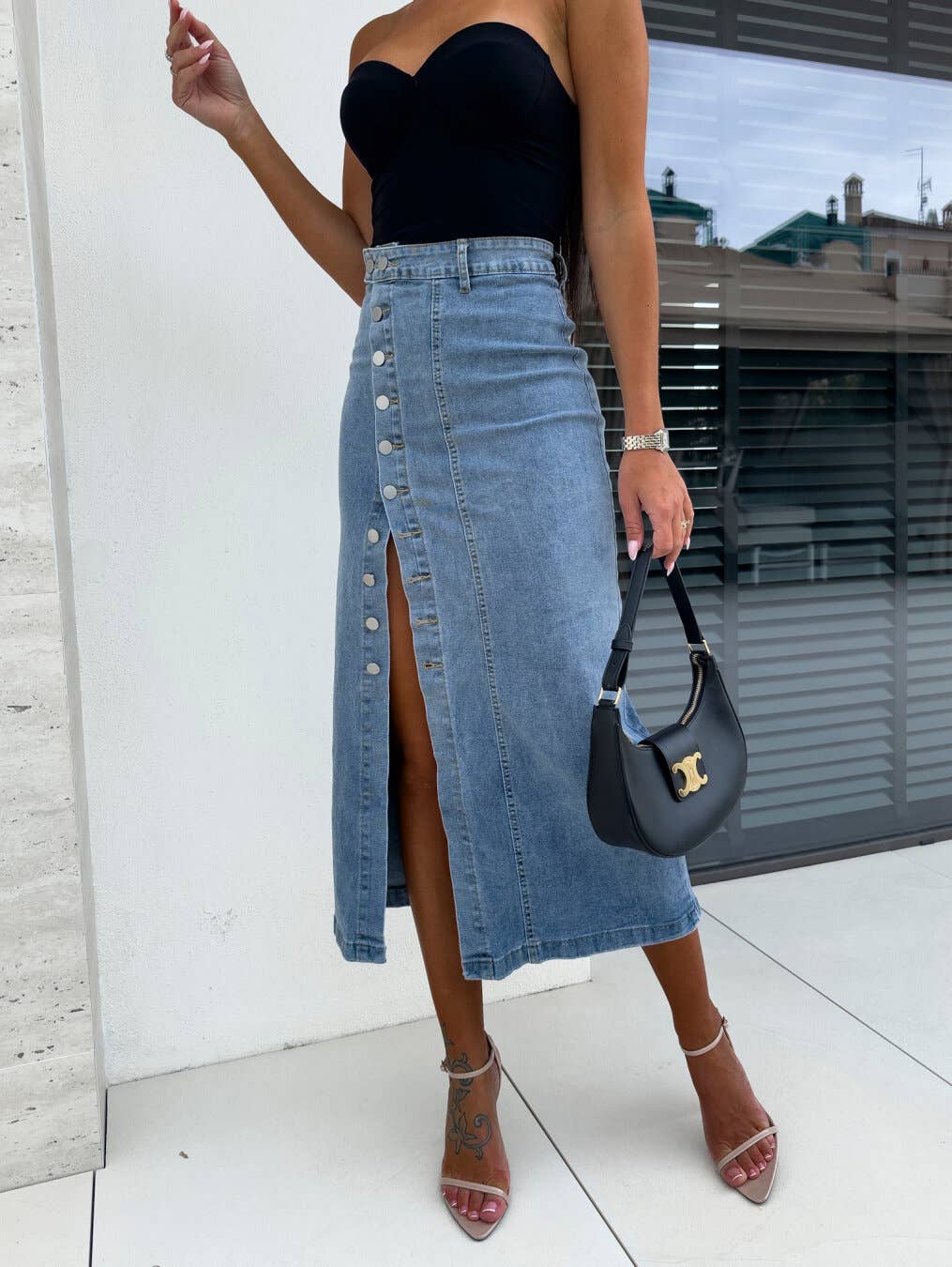 Buttoned asymmetrical high-waisted denim skirt