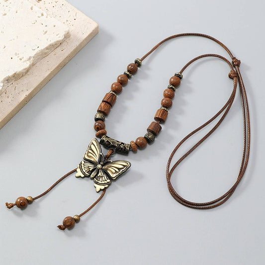 LONG WOODEN BEAD BUTTERFLY TASSEL NECKLACE