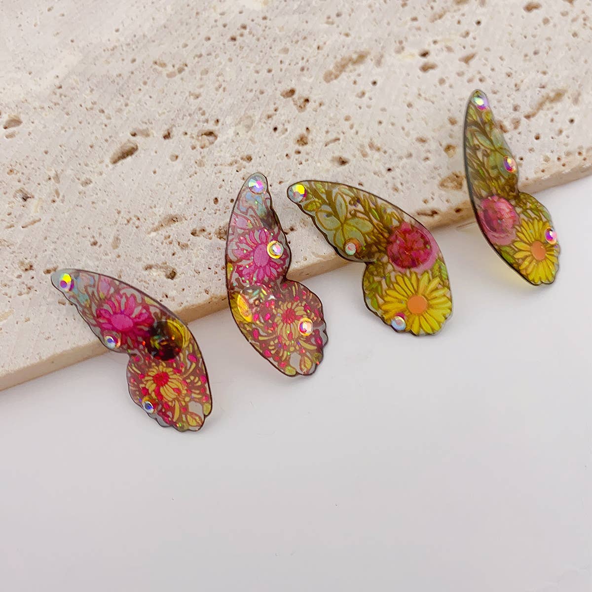 Painted ear studs with simulated butterfly wings