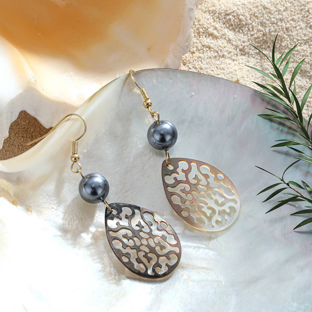 CREATIVE HOLLOW CARVED NATURAL SHELL EARRINGS