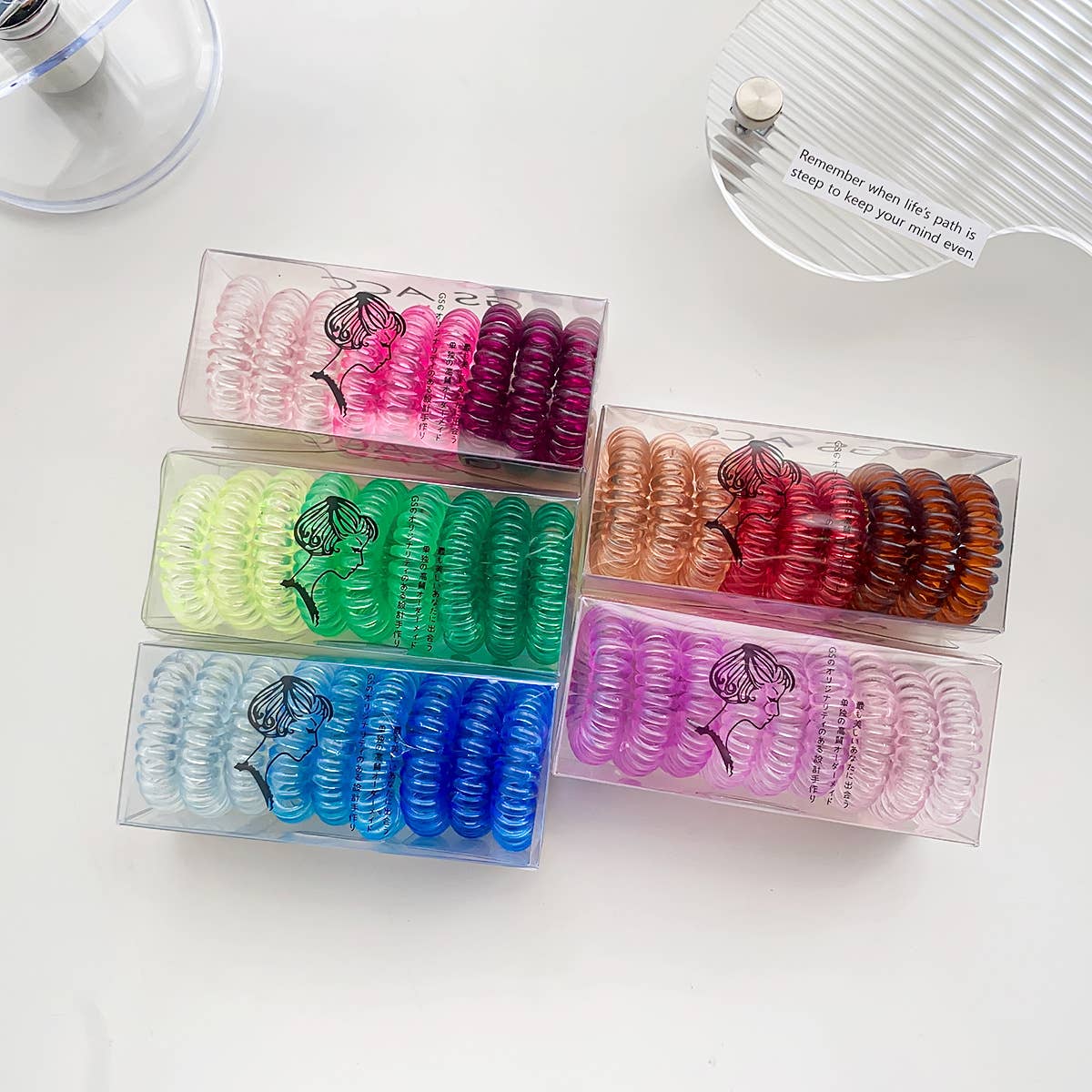 Nine candy-colored rubber bands for hair ties