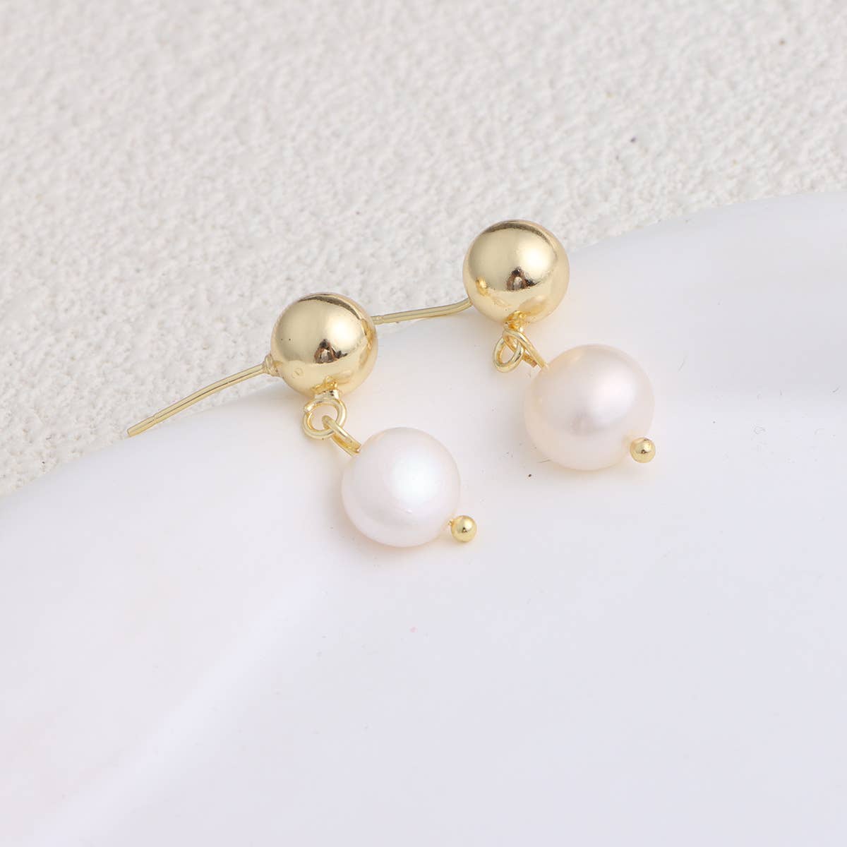 Trendy metal bow freshwater pearl earrings