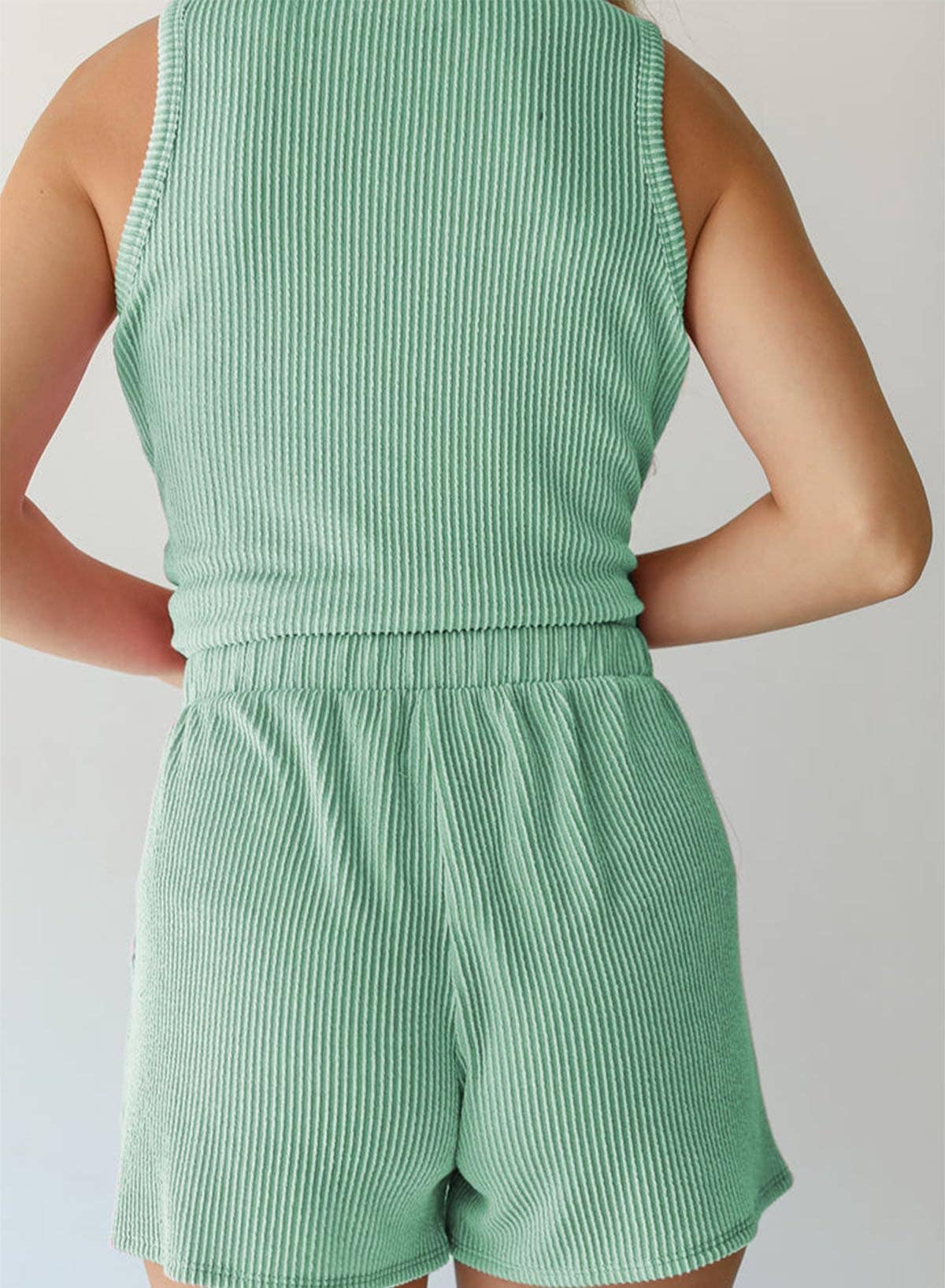 Twisted sleeveless vest, shorts and striped suit