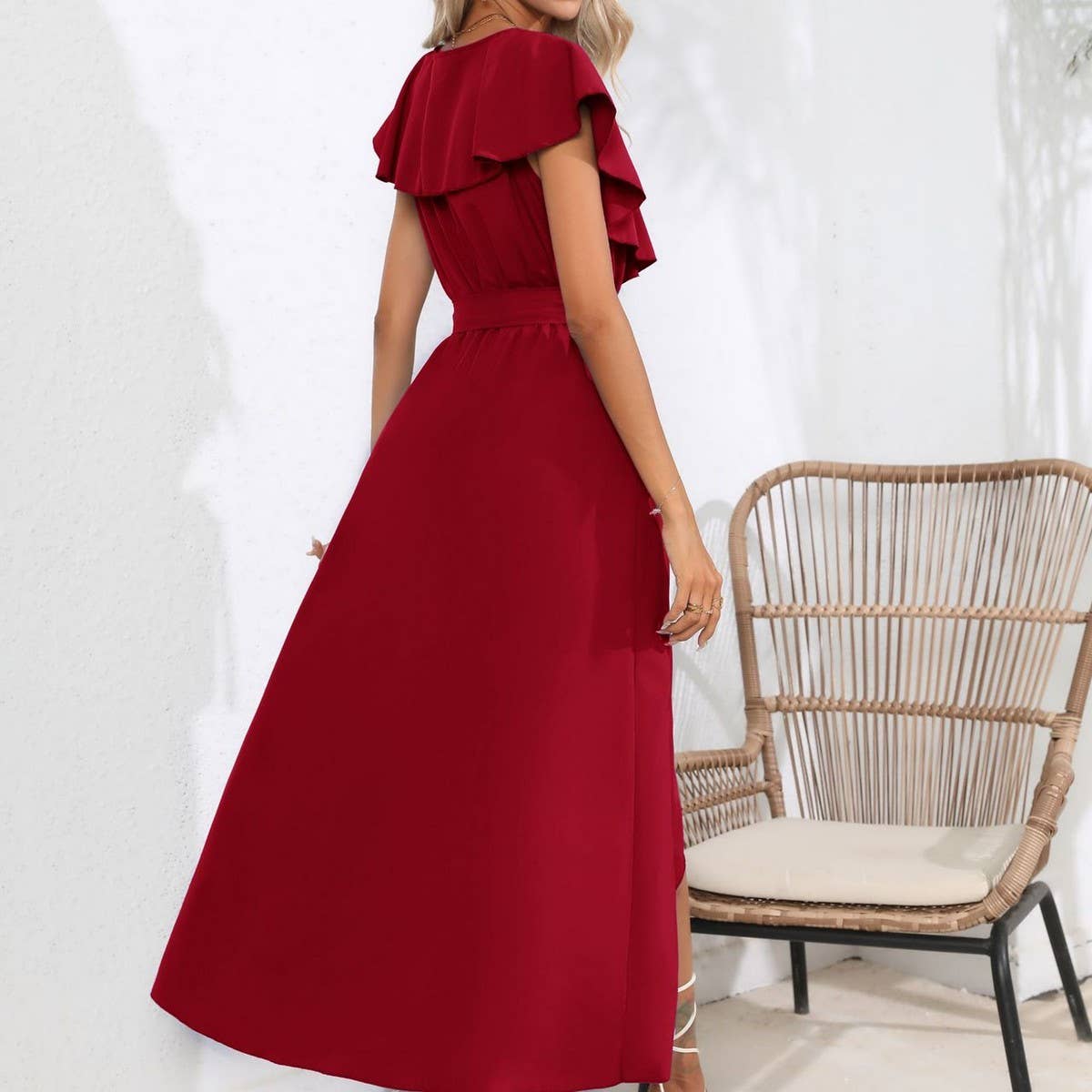 Long sleeveless dress with ruffled V-neck