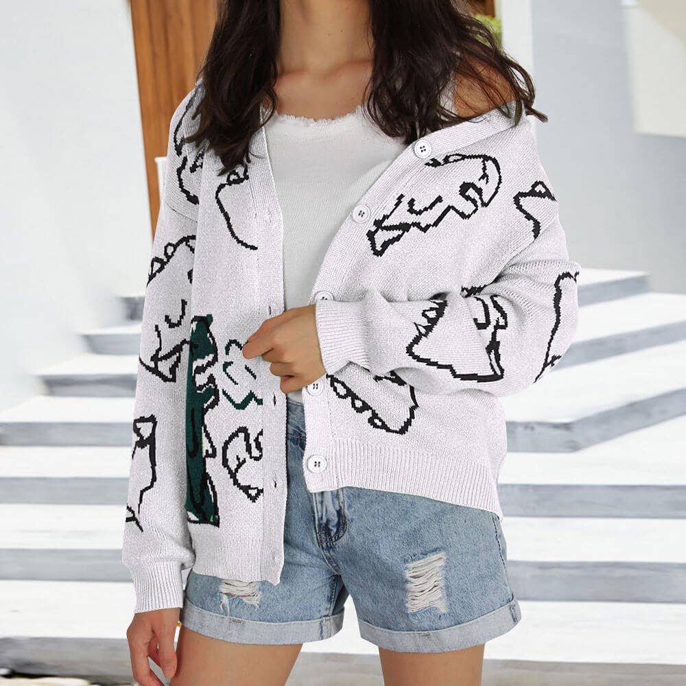 THE JACKET IS A LOOSE CARTOON DINOSAUR CARDIGAN