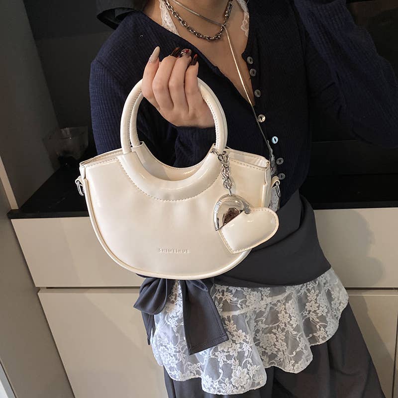 Fashionable and versatile hand-held crossbody bag