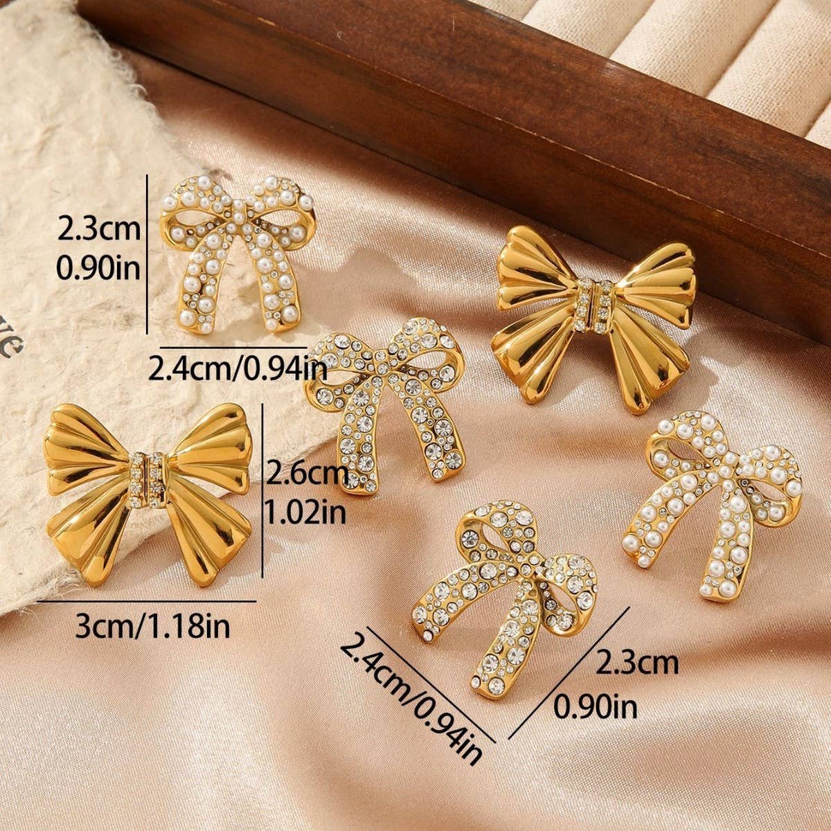 TITANIUM STEEL BOW EARRINGS INLAID WITH RHINESTONES