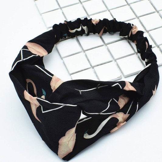 Silk hair band with interlaced patterns