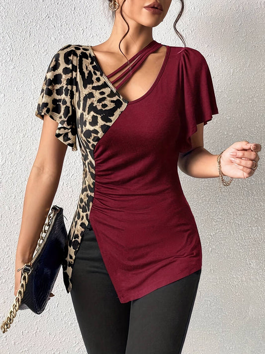 A leopard print asymmetrical collar patchwork top