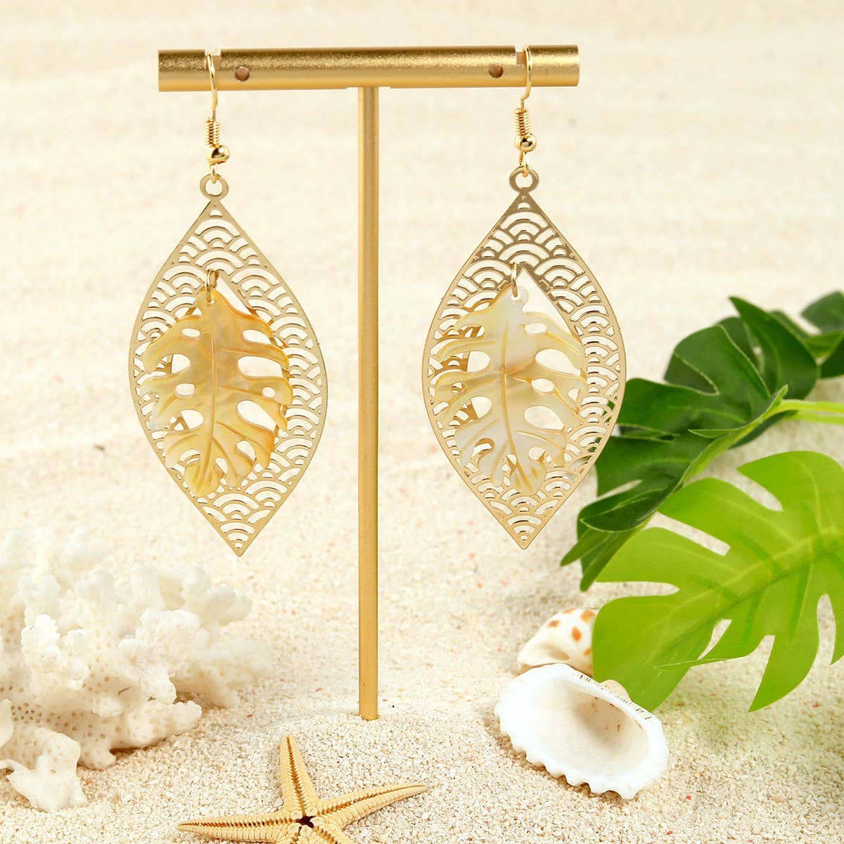 HOLLOW YELLOW SHELL LEAF CARVED EARRINGS