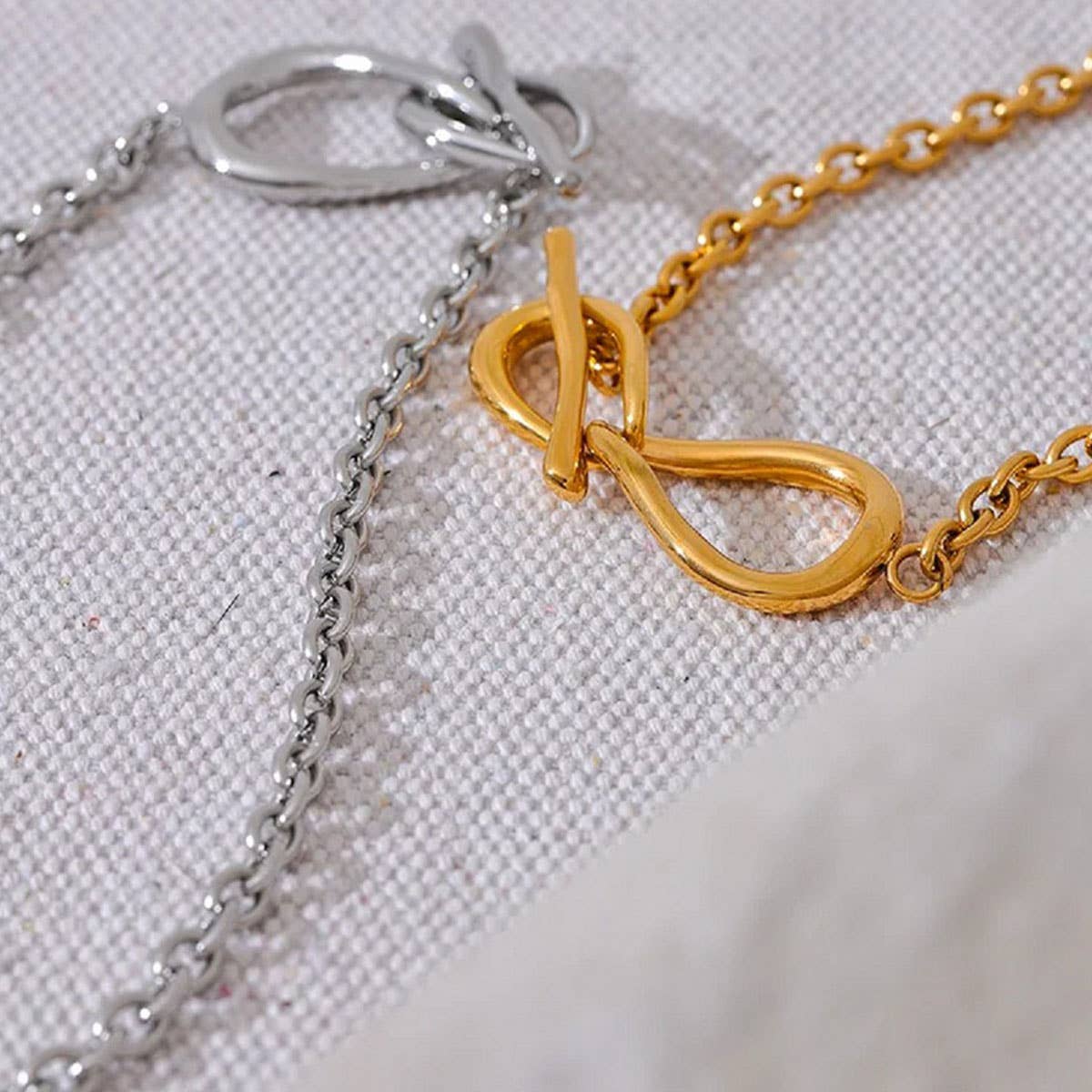 Titanium steel necklace with bow pendant