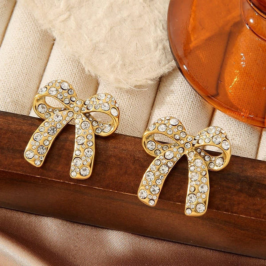 TITANIUM STEEL BOW EARRINGS INLAID WITH RHINESTONES