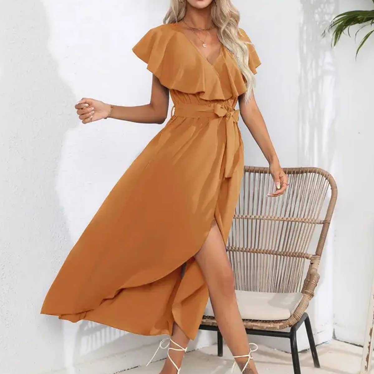 Long sleeveless dress with ruffled V-neck