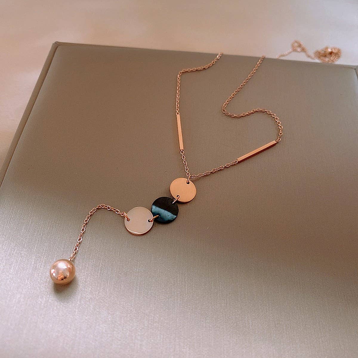 GEOMETRIC SEQUIN TASSEL NECKLACE